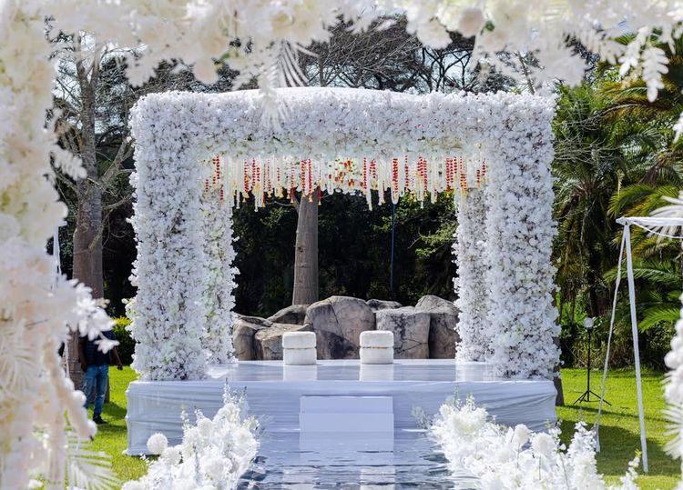 Events by Zay celebration project: elegant outdoor wedding ceremony framed with white florals